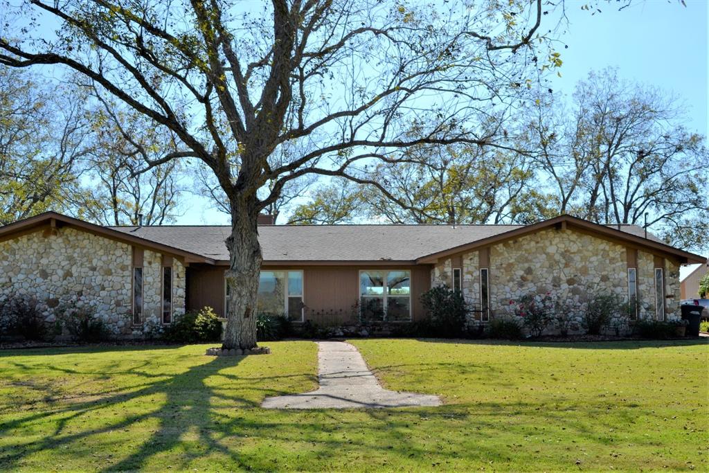 9748 County Road 160 Road Boling, Texas Looking for a retreat? This beautiful ranch features 4 bedrooms, 2.5 baths on 4.1 acres. This home is perfectly laid out for family enjoyment with the large combination kitchen/living/dining area! The kitchen features numerous custom cabinets and countertop galore, making it perfect for all your gatherings. The large back porch is a wonderful place to sit and enjoy the smells and sounds of country living. Also included with this beautiful property is a 48x42 barn with concrete floors.