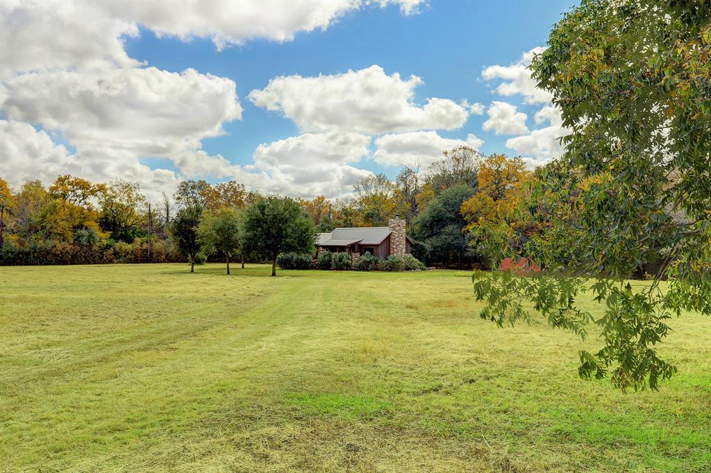 7300 Great Oaks Circle Burton, Texas Only 13 minutes from Round Top, Texas down beautiful Mayer Cemetery Rd is Great Oaks Ranch. This rolling 6.58 acre property has a fully furnished two bedroom one bath country cottage backing up to beautiful live oaks and a deep bedded seasonal creek with woods surrounding the back property line. This would make a fantastic country retreat with great access to Round Top and beautiful Washington County!