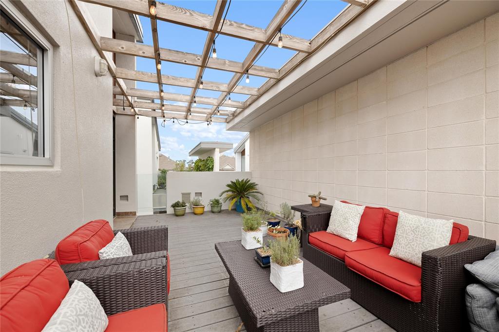 Spacious roof deck with plenty of space for a table or lounge setting as shown.