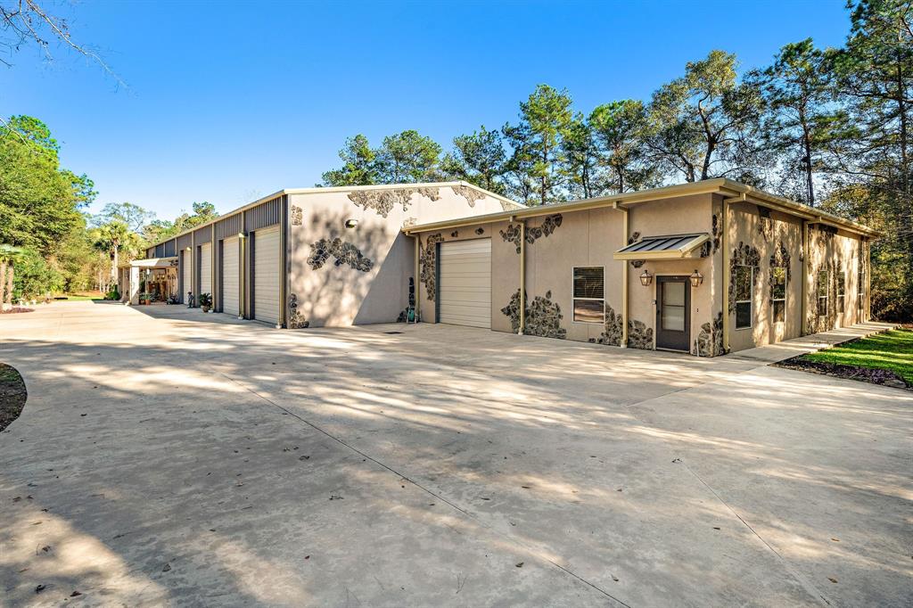 28626 Dobbin Huffsmith Road Magnolia, Texas Welcome home to peaceful country Ranch Style Modern Contemporary 4-bedroom 3 bathrooms 2-1/2 baths Barndominium retreat on 5 ac. (2 living quarters)Nestled in the quiet suburbs. NO HOA, Main House, you will enjoy an open concept Great Rm for entertaining family/friends. Impressive open concept kitchen, living w/granite counter tops ,tile floors, built-ins and crown molding, ceiling fans, refrigerator, wine cooler, Viking Professional double, plenty of storage, walk-in pantry, surround sound, wood burning fireplace, pool, waterfall w/cave & hot tub. Spacious primary bedroom & bath w/double vanities, air jet tub, oversized walk-in closet w/built-in drawers. Oversized laundry room, 4 bay garage/shop spaces area 60' deep with openers, 1/2 bath HVAC, 50 amp plug & dump station, Generac 80 KW... Conveniently located just minutes from Woodlands Parkway, Aggie Toll, Hwy 249, 99, 45, close to shopping and restaurants.