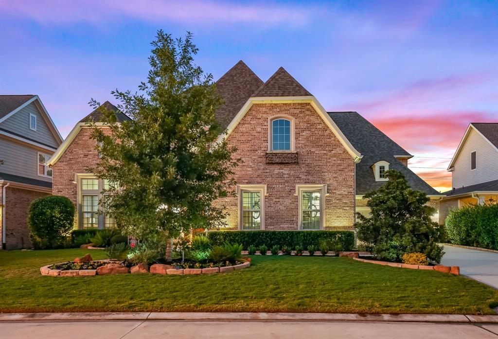 2315 Bottlebrush Lane Conroe, Texas Stunning Darling Home located in the sought after community of Stillwater. You'll love the combination of luxury and cozy charm. This home boasts soaring ceilings throughout, exposed brick walls, an open and spacious floor plan and first-floor media room with wet bar. Off the gourmet kitchen enjoy the breakfast nook and inviting fireplace. Upstairs you'll find a game room with exposed beams and 3 spacious bedrooms with en-suite baths. Spend your evenings relaxing around the fire pit in the peaceful and private backyard retreat. Your dream home awaits! Schedule your private viewing today.