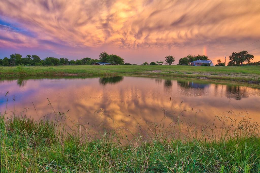 4776 CR 220 Anderson, Texas BEAUTIFUL rolling land with meticulously maintained native pastures, native trees with tons of wildlife, 2 lakes, 3 wet weather creeks, re-modeled 1BR/2 Bath weekend cottage, large patio with AMAZING views, several hilltop home-sites w/views, along with a barn with stalls, fenced/cross-fenced, metal building shell(equipment barn). One working well, 2 wells needing work. Wooded and open areas. MUST SEE PROPERTY! Partial Minerals Convey. Ag Exempt.