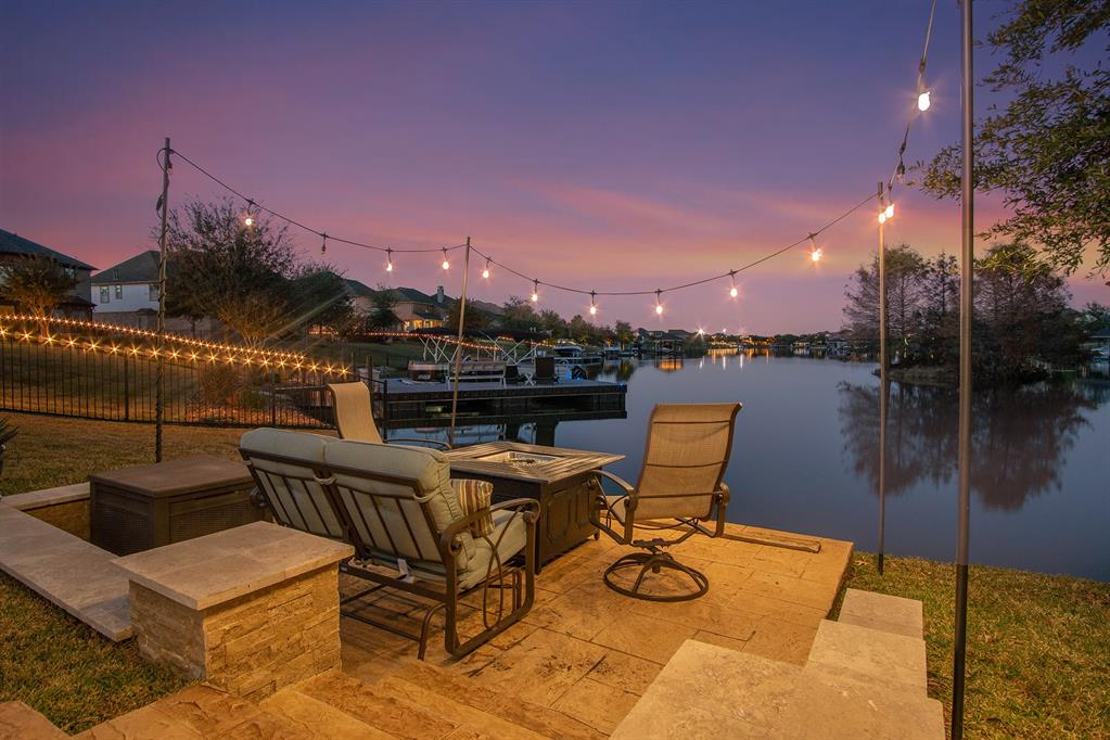9506 W Pedernales River Drive Cypress, Texas A LAKEFRONT ESCAPE: Luxurious and completely remodeled (300K in upgrades/remodel), this home rests on a hard to find lot in a much sought after Towne Lake. Richly-appointed with an abundance of windows that provide a lot of natural light and thoughtful open plan layout includes large family room with cozy fireplace and professional-grade kitchen. The expansive backyard includes a sparkling POOL with water features. Enjoy breathtaking sunsets at a lower patio sitting area, all in private, verdant professionally landscaped surroundings. Chef's kitchen is equipped with high end professional appliances, custom range hood, glass backsplash. The cabinetry has custom paint, maximized storage with cabinets on both sides of the island. This is a smart home with automated security system, irrigation, wifi, Hunter Douglas shades. Primary bedroom looks over the pool and the lake. Low Tax Rate. You have to see it to fully appreciate everything that this dream home has to offer!