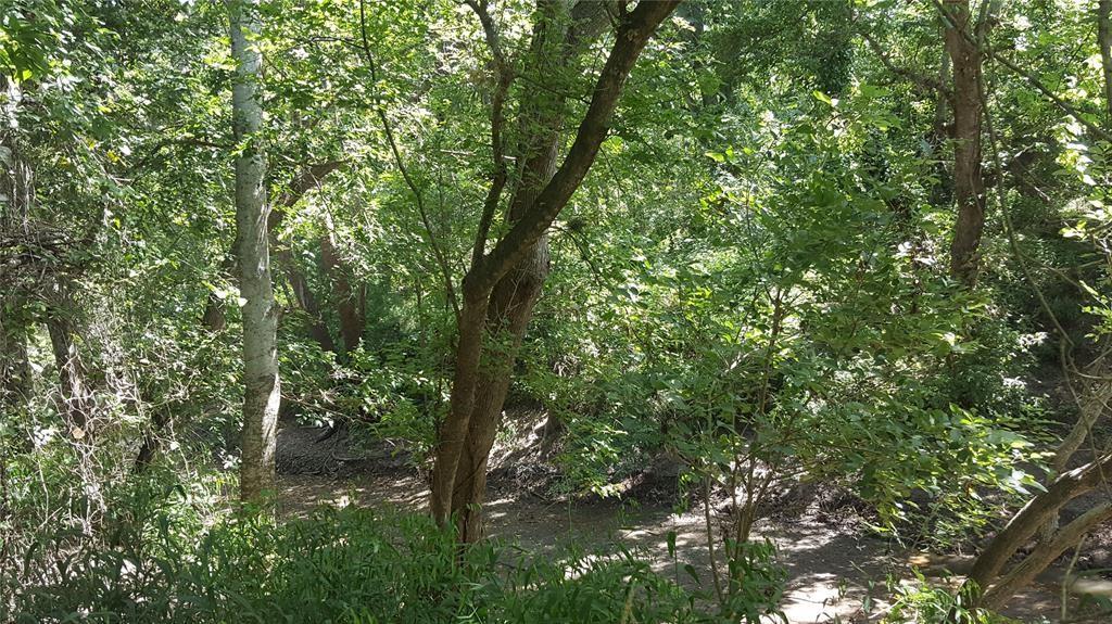 000 CR 138 Hallettsville, Texas Incredible property located approximately an hour and a half from Houston, Austin and San Antonio! A great mix of heavily wooded areas, beautiful mature trees and open pastures on the Navidad River which offers the perfect habitat for a plethora of wildlife. 100 + year old barns, nice size pond and plenty of room to roam. Paved County Road access. Minerals negotiable! A portion of this property does flood when the river breaks bank. Ag exempt.