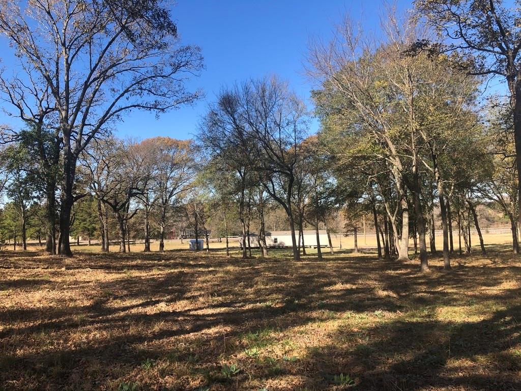 767 W Hwy 79 Buffalo, Texas 36.85 Acres located just outside of Buffalo on Hwy 79. 3/2 manufactured home with water well and new septic system. This property is fenced with woods and pasture. With the layout of the land, there is plenty of space to use as a homestead and business while still allowing room for hunting and grazing. Several nice homesites off the highway to gain your privacy. The deer are seen daily. No restrictions or zoning.
