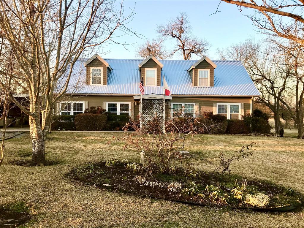 5610 County Road 342 Navasota, Texas Country Retreat on 12.55 rolling acres with pond, soon to be 5 miles from the new Aggie HWY, 249 & 105. Beautifully manicured property with a 2 story, 1800 sq ft of finished space and an additional 1100 sq ft of plumbed unfinished space to design as you desire. Large living open to breakfast, which is open to large kitchen, formal dining or office can be closed off from main living space. Primary is large with on-suite. 2nd bedroom with full bath on opposite end downstairs. Laundry off kitchen. Carport is large & has attached workshop, storage room. Morgan shed out back. Yard is fenced and pasture is fenced on 3 sides. Barn on a slab, can be driven straight though, has plenty of space for tractor, toys & space to create any projects. Approx. 40 x 60. RV storage shed next to barn. Owners are avid gardeners, garden is fenced. Escape the the city, be a physical distance from your neighbors. Come relax, 4 wheel, bring your kids, animals - whatever you wish & enjoy gorgeous hillside views.