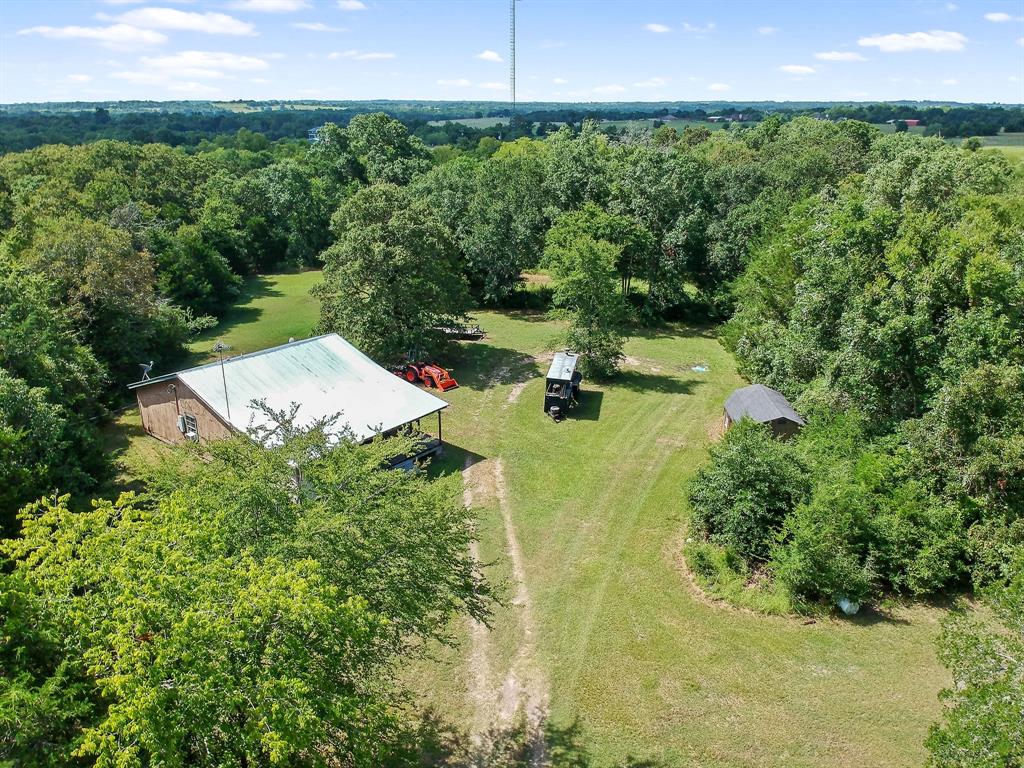 4731 Scenic View Drive Anderson, Texas Just a few miles outside of the quaint town of Anderson lies this beautiful 7.975acre track with beautiful lush green trees. The Property has 3 Bedroom, 1 Bath home, Family room, Kitchen with Breakfast area, Laundry room, Master bedroom, Office, Walk-in Closet, and Master Bath. There are some repairs needed - great for small fixer-upper projects! The washer/dryer and The Refrigerator is included. Covered front porch and 17x14 Storage shed. Low taxes, No HOA fees, no restrictions. Great property for living in Anderson Texas. Anderson is a charming little town that is highly sought after because of its great Anderson and Navasota schools. Located in the rolling hills of Grimes County and in the sought-after Navasota ISD, The property features with gorgeous long distant views of the countryside, paved road frontage, and easy access to both Houston and College Station.