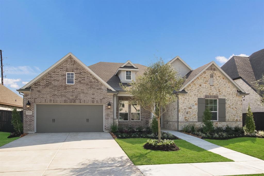 1123 Sweet Dumpling Drive Richmond, Texas NEW DAVID WEEKLEY HOME! SAVE BIG with our energy program! This gorgeous, one story home features an open concept kitchen with an oversized center island, Cathedral Ceilings in Kitchen, Family room and Owner's Retreat! Boasting white kitchen cabinets, upgrades galore, an abundance of natural sunlight and light colored wood look tile, this energy efficient home screams new, open and bright! The luxurious master suite has a stunning Super Shower upgrade, perfect for relaxing after a long day. Largest over-sized rear covered patio, full sprinkler system and full sod. This one-story home features a TV room and a 4 Car tandem garage. Enjoy fabulous amenities in Harvest Green and easy access to Grand Parkway 99! Model Home, Open daily!
