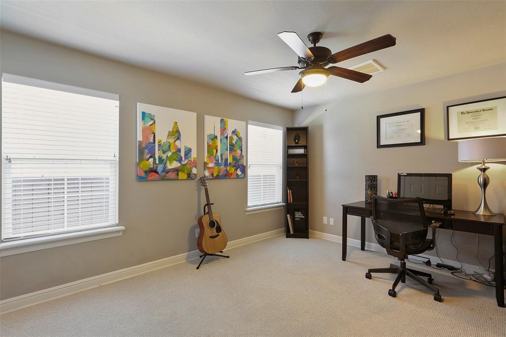 The spacious first floor bedroom can also function as a study or exercise room.