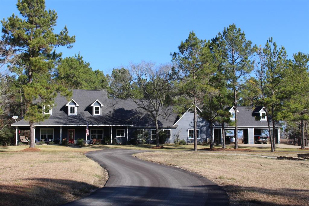 24540 Gay Lake Rd Montgomery, Texas Delightful modern ranch home on 12+ secluded acres in Montgomery ISD. 3,021 sq. ft., built 2010, one story, 3 bed 2½ baths, recently painted inside and out. Wide plank pine floors throughout recently sanded and re-stained. Island kitchen upgraded with quartz countertops, soft closing drawers and cabinets. Sitting room off primary bedroom with wood burning stove. Primary bath with claw foot tub, double sinks, separate shower. Family room has extensive cabinetry for craft projects. Attic area framed in as potential fourth bedroom. 8 ft wide covered porches on three sides. 4-car carport. Asphalt circle drive. Shop building beside the home with power, two roll up doors. Land is rolling, part open part wooded, no flood plain, wildlife exemption. Light restrictions in place, horses allowed. Easy access to shopping, dining and medical. Close to Lake Conroe and Sam Houston National Forest; about half-way between Houston and Bryan/College Station.