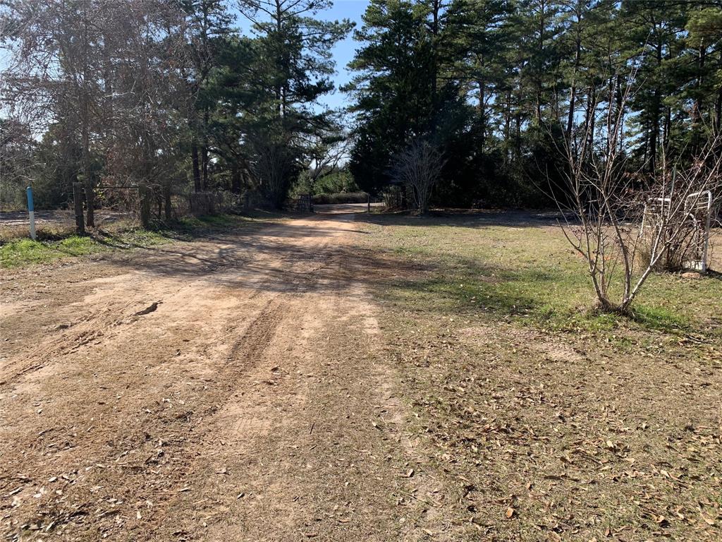5751 Fm 811 Centerville, Texas Looking to get away from the hustle and bustle of the city? Check out this 5 acre parcel with 2 water meters, 2 septics, and electricity already in place. Conviently located between Houston and Dallas and 15 minutes from I45. There is a cute 1 bedroom, 1 bath camphouse/cabin with a new metal roof that can be used as a mother-in-law house, a guest house, or to stay in while you build your dream home. The possibilities are endless. Just outside is a gazebo for your pleasure to enjoy your coffee on those cooler mornings. There is also a 3 bedroom, 2 bath, double wide with a metal roof that is in need of repairs. In addition to this fully fenced in property there are also 2 storage sheds, and a barn. The many fruit trees on this property include plum, peach, pear and black berries. There is also a pecan tree. There is not a survey. This is an AS-IS sale. With a little TLC, this place would be an amazing sight! Come check it out today!