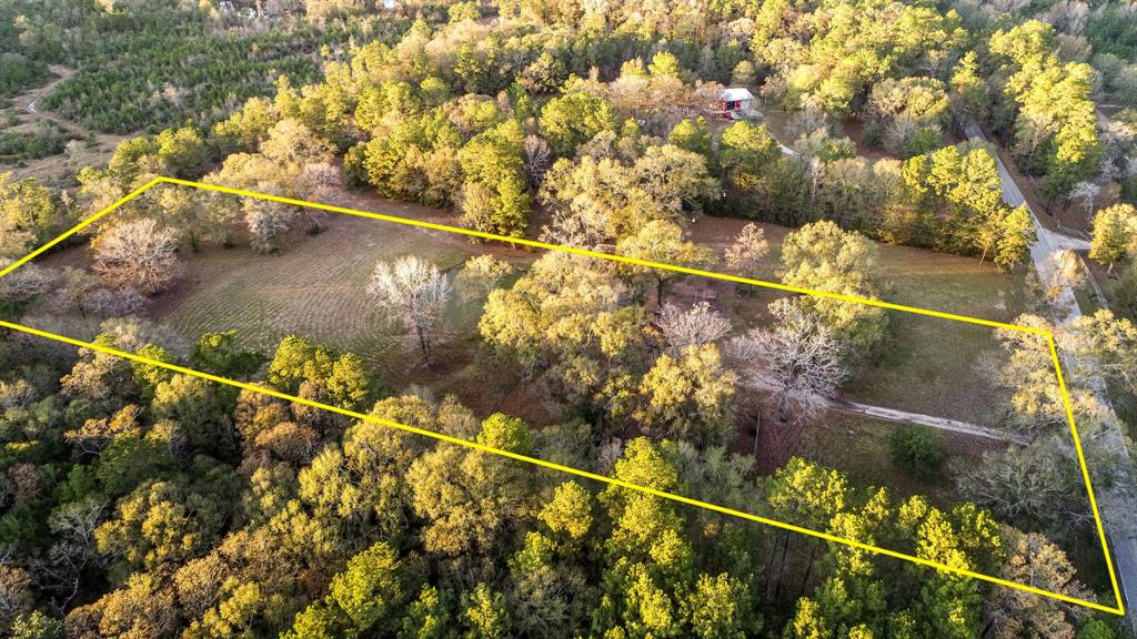 6676 Daw Collins Road Cleveland, Texas Rare opportunity to own a one story home on unrestricted, 4.73 acre tract, off Daw Collins. Home is a ranch style home just waiting for your personal touch. The property is gorgeous, has large trees, is extremely high and dry, and some of the most beautiful property I have seen. The sunset views off the back porch over looking the pond is breathtaking. This price reflects the home needing some updating, but you must see the land it is on to appreciate what a rare opportunity this is. This won't last long. Owner is agent.