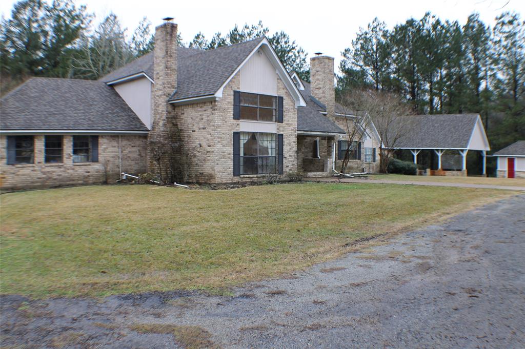 6951 E County Road 315 Buffalo, Texas Pull into the gated drive down the tree lined drive to see a French Country Treasure! The Grand Entrance is flanked by stairway and balconies. On either side you will find a living areas-both with wood burning fire places. The Elegant Dining room has new wood laminate floors along with double French doors to the spacious back patio. The kitchen boasts of granite and new appliances set on tile flooring. The breakfast nook sits in a bay window with a full view of the beautiful back yard. The Primary Bedroom is access through yet another sitting area. The Bathroom has a Hollywood Style Shower and Double Vanity. Still there is more on the first floor. A study is set with French doors out to the patio. There is a huge closet for all of the extras that need to be filed and put away.
Upstairs you will be greeted with a quaint bathroom with claw foot tub and bead board walls. A large bedrooms opens to an upper deck, the last bedroome accesses 2 cedar lined closets. A MUST SEE!