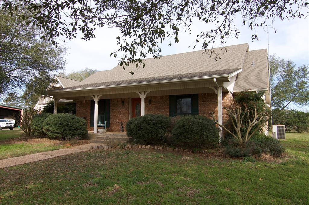 1110 Private Road 6002 Giddings, Texas 36 ACRES, 2498 SF HOME, POOL, BUNK HOUSE, HORSE BARN, PONDS & MORE This awesome 36 acre property is located at the south end of Lee County, near the Lee/Bastrop County line. This tract has rolling terrain, with the highspot at the back where the home is located. Some of the features include granite countertops, tile and wood floors, wood stove, large primary bedroom and bath, gated entry w/keypad, two-car garage, finished apartment over garage, raised deck, swimming pool, large back patio, RV storage, and a two bedroom bunkhouse - which is great for guests. The property is fully fence with cross fencing. Farm and ranch extras include a 4-stall horse barn, a feed/hay barn with workshop, cattle pens, cattle shoot and scale, loafing shed, four ponds and water troughs. The tract has approximately 581' of road frontage on FM 2239. The main entrance is shared with two neighboring tracts.