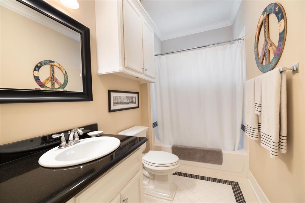 Located just off the secondary bedrooms is this full bathroom, which includes classic finishes.