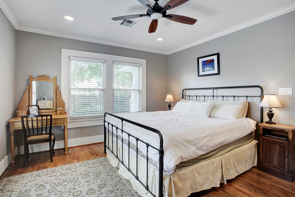 The generously sized primary bedroom sits at the back of the home off the family room and looks out onto the back yard.  This is a king sized bed and there is plenty of room for night stands.