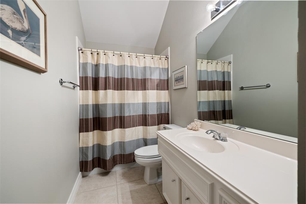 The second floor full bath is located in the hall between the two bedrooms, equally convenient to both.