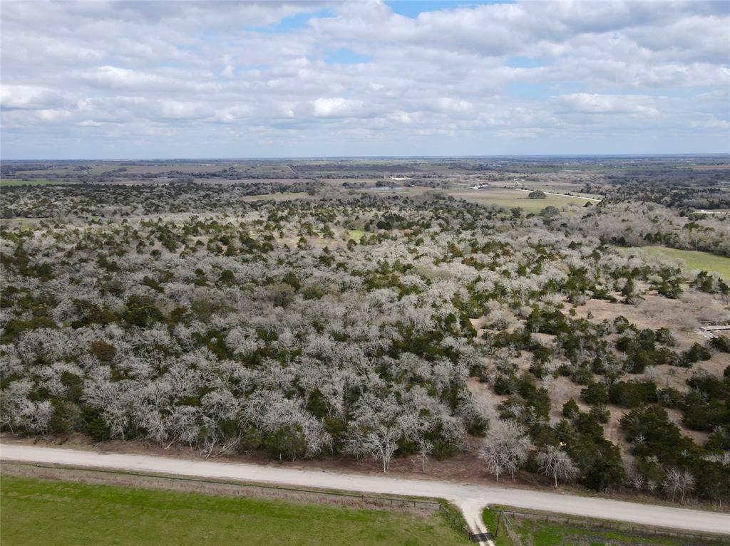 331 County Road 284 Flatonia, Texas Rare, hard to find small tract of land in Lavaca County. 15 acres with mature oak trees, wooded terrain, and a dry creek. Great building site with natural privacy from the road and the neighboring properties. Perfect for building your dream home, or weekend getaway barndominium. Just minutes off Highway 95 in between Moulton and Flatonia. Paved road frontage, new entrance, and ready to be built on! Properties this size are hard to find in this area! Come take a look at this awesome tract of land!