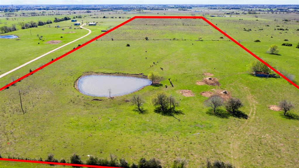 1276 Bernardo Road Cat Spring, Texas This is truly a gem of a piece of property. There is no way to show it to you in pictures but from the front gate to the trees and pond is a hill that you climb. It is the PERFECT spot to build a home not only looking over the pond but it has an amazing view over the Bernardo, Cat Spring Area. It's quiet down this county road with green grass and cows as far as you can see but the view from the back of the property, you can faintly see I-10 which means you get the best of both worlds. You will enjoy the country life but are convenient to I-10 to get to work in the morning or head to town for errands. This property is perfectly rectangular and already has an electrical line that runs through the property. This property has been in the same family, basically since the beginning of this area being settled. Only 35 miles from Katy which makes commuting into Houston an easy trip. Unrestricted and ag exempt. You have to see this one in person to really appreciate it!
