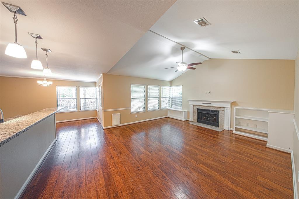 49 Sawmill Grove Lane The Woodlands, Texas EXTREMELY PRIVATE RETREAT with amazing finishes in The Woodlands! This updated 2-story townhome has the finishes of a custom home, including a full LG Stainless Appliance Kitchen (Fridge, Dishwasher, Gas Range / Double-Oven, Microwave, Washer, and Dryer), soft-closing cabinets AND drawers, granite, continuous laminate flooring, two inch blinds, built-in gas log fireplace, and a wall of windows looking out to your private backyard retreat. Secluded owners retreat is conveniently located downstairs with en suite bathroom, upgraded with glass shower and granite counters. Two additional bedrooms are found upstairs along with another full bath. Enjoy easy access to shopping, dining, outdoor entertainment, hike / bike trails, and of course the amazing Woodlands Schools. Excellent storage space throughout home! Garage is attached in breezeway! Must see, will go fast!