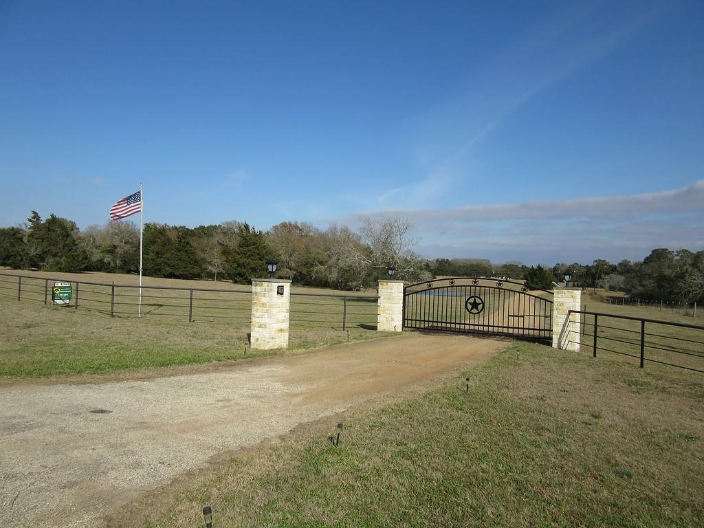 9953 N US Highway 77 Schulenburg, Texas This beautiful one of a kind 42.91 acre ranch is situated on U. S Highway 77, seven miles south of Schulenburg, in the heart of the gently rolling countryside of north central Lavaca County, Texas. The four bedroom, 2 1/2 bathroom, custom home was built in 1993, by a noted area builder. It also features lots of ample storage, built-ins, a laundry chute from upstairs directly into the downstairs utility room, and easy walk-in access to attic storage. It is very clean and well maintained. The house is approximately 1/4 mile from the highway. The driveway crosses a large stocked pond which is stocked with large mouth bass and catfish for your fishing pleasure. Barn, pens and cross fences are in place as part of the ranch operations. The acreage is about 2/3 wooded. Seasonal creek crosses the entire width of the back side of the property. Whitetail deer, wild turkey and other wildlife abound. This property is owned by a TREC Licensed Broker. Come see this one of a kind property.