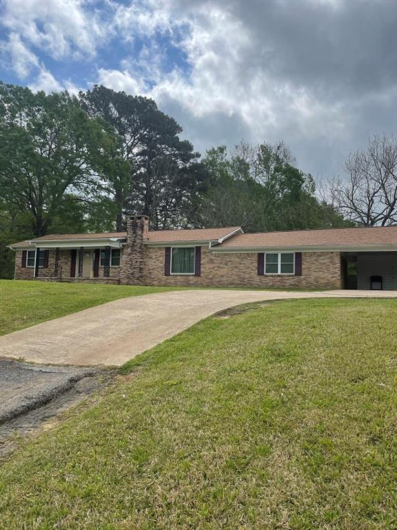 5162 N US Highway 79 Palestine, Texas 11.691 AC. – 5162 N US Highway 79 - Palestine, TX – COUNTRY LIVIN’, CLOSE TO TOWN – Here is a hilltop country home on 11.691 acres featuring 4 bedrooms, 2 baths, 2 living spaces, and wide-open space in the kitchen & dining area. 11.691 beautifully timbered acres with several open areas featuring a few storage barns/buildings. Large mature Pecan Trees, and several fruit trees. This property fronts US Highway 79 and has frontage and rear access off County Road 367. This home has had some remodeling and updates done over the years. Updated flooring, windows and doors, new roof put on 3 years ago. This would be the perfect place to retire from the big city and have plenty of space for all those grandkids, or the perfect place to raise the family in the country with lots of space to roam. Give me a call today to set up your personal showing. Trust me you don’t want to miss out on this opportunity.