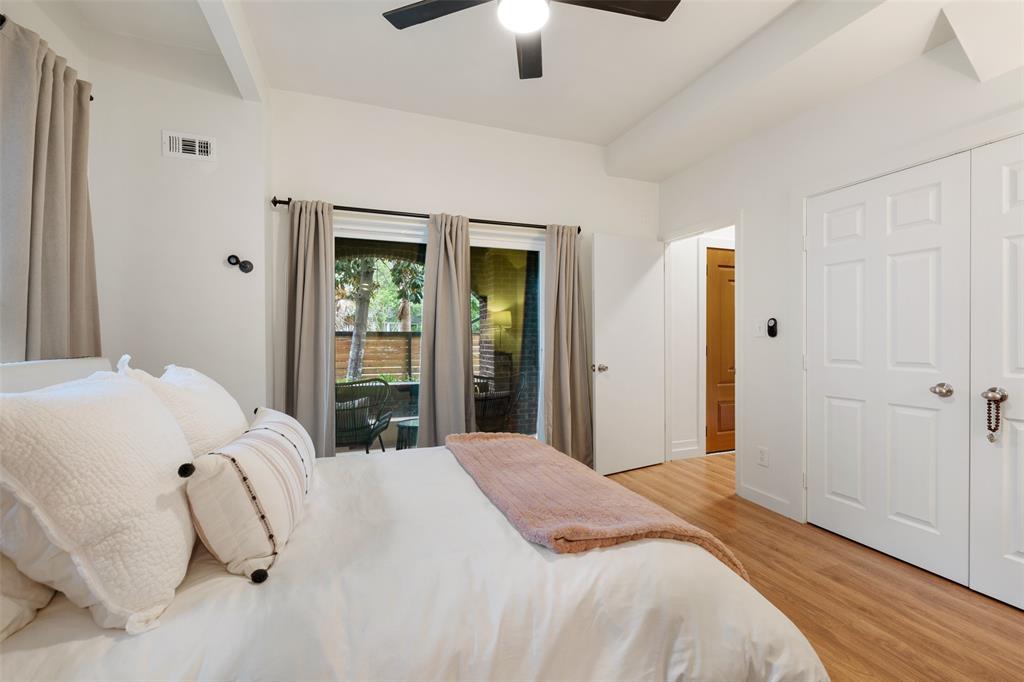 Downstairs you will find this large secondary bedroom with high ceilings and a large closet.