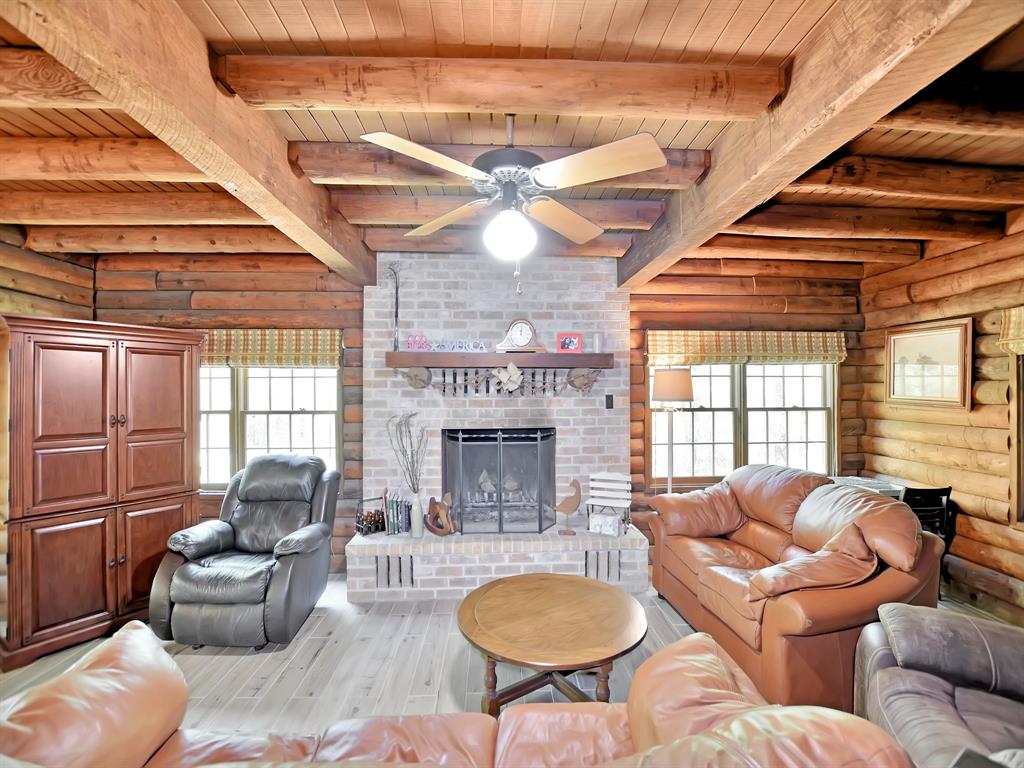 1057 Ben Blair Trinity, Texas If you are looking for quite little get away from the city or your own secluded place to call home this is the perfect place to look. This log cabin has all of the comforts you could ask for with all of the space and acreage. It has been well maintained with recent staining and a new tile flooring within the past few years. The large shop outside has power so that you can do all of your projects without any trouble. There is a 100 ft water well that guarantees to not run dry and if you wish to attach to the city water system that is located at the front of the property. That can be tied in at a later date and time.