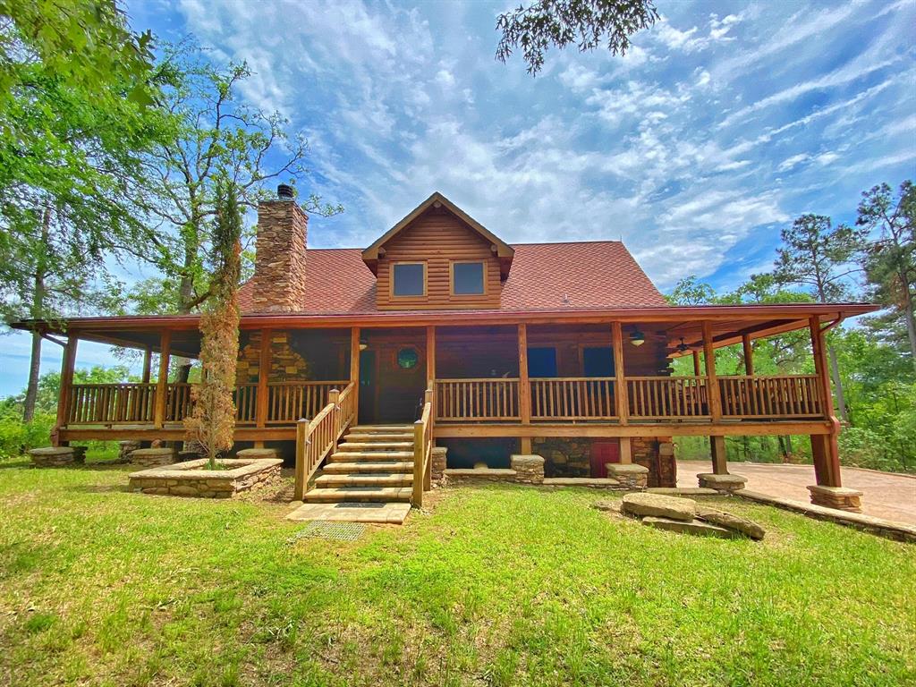 11275 PR 1200 Leona, Texas 75 acre private ranch with gated entry, featuring rolling hills, mix of timber and pasture, 1/2 mile of stabilized interior roads, 1-acre stocked pond and access to year-round, spring-fed Boggy Creek. The crowning jewel of the property is the 3 story log house that sits on a 100 ft. bluff with unmatched views. The property has been very neatly maintained and well kept. As you enter the property, a large, 2 story barn with living quarters is showcased on a hill. Attention to detail was made in each aspect of the barn and the quality is unmatched. Excellent privacy and ease of travel are throughout the ranch. Both the cabin and living quarters in the barn are being sold furnished.
The ranch features include:
Log Cabin - 3-story with 2-bedrooms and 2-baths, 3419 sq ft total under roof, 1684 sq ft heated/cooled, very deep 2-car garage with work area and laundry, and a wrap-around porch overlooking a 100 ft. bluff above spring-fed Boggy Creek.