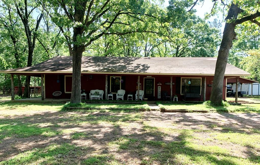 372 County Rd 2131 Crockett, Texas This beautiful country home on 12 acres is located just off FM 2160, north of Crockett, TX. The asphalt country road leads you to the pipe entrance. There are nice, large porches on two sides of the home, and a wooden patio area on the back, near the carport. Through the back door and to the left, the kitchen looks out over the dining area and large living room. The master has a huge walk-in closet with center island/shelving and an additional door into the master bath. Through the secondary bedroom, there is a room that is currently being used for storage, but it could also be a cute little sitting area, office, etc. There are many unique, rustic touches to this home that make it stand out. Multiple fruit trees (mostly pears and peaches) add to the beauty of this peaceful setting. There are many outbuildings and barns in place, allowing for tons of storage space and room for your animals! This property is fully fenced/cross fenced and has multiple pastures, one with a pond.