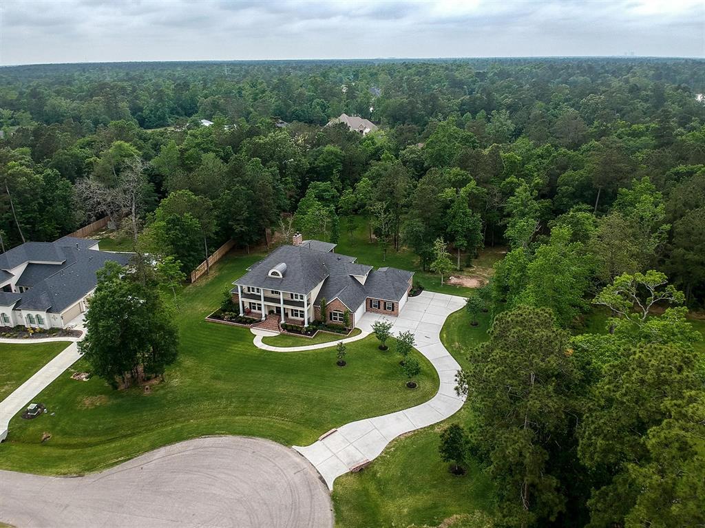 27411 Jupiter Landing Court Spring, Texas Sprawling 1.75 Acre Luxury Property located in Benders Landing Estates. This 5 bedroom, 4 car garage custom home is expansive and situated on the left half of the beautiful Jupiter Lane cul-de-sac. Home is a "showstopper" with it's classic design and a touch of southern comfort. The entry is grand yet warm through the double doors and boasts impressive features throughout with luxury level flooring, lights, appliances, finishes and features. Home is light, bright, neutral and could welcome any buyers taste in design. Home offers a study, formal dining, family, breakfast, kitchen, 1 of 2 game rooms, a secondary en-suite bedroom and a luxurious primary suite all on 1st floor. The 2nd level offers a 2nd game room, media, 3 bedrooms 1 with an en-suite bath and a Jack and Jill for the other two. Acreage in this community is in short supply and high demand. Tour today and this premium 1.75 acre property could be your new address.