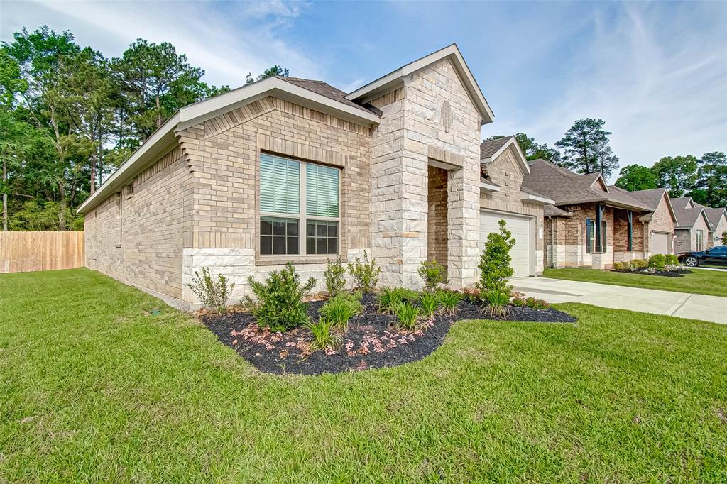 14348 Zion Gate Crossing Conroe, Texas With a quiet tree lined easement and large backyard, 14348 Zion Gate Xing is sure to wow! Gorgeous wood-look floors, granite kitchen countertops, three bedrooms, 2 baths, and a large open living and dining space is perfect for any living needs. The primary bedroom boasts double doors leading to a large glass surround shower, soaking tub, and double sinks. Two secondary bedrooms give enough space for additional sleeping arrangements or set up your work from home needs with a home office space. Enjoy a beautiful evening on the back patio while you hear the birds chirp and the quiet serenity of having a tree lined easement and no back neighbors. Come by and see 14348 Zion Gate Xing, now for lease.