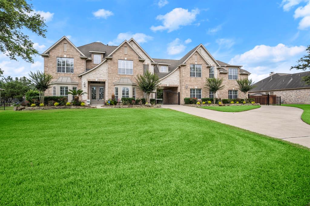 17218 Calico Peak Way Cypress, Texas Beautiful two story Trendmaker home on water lot in the sought after Lakes of Fairhaven. Desirable Porte-cochere elevation with brick, stone and gated driveway with additional driveway for parking. This home offers 5 bedrooms including the primary suite downstairs, 4 bedrooms, two large game rooms, media/theater room upstairs! Formal dining room and large breakfast area. Large study with french doors. Kitchen features: island, granite counter-tops, double ovens with warming drawer, gas cook-top, and large walk-in pantry. Primary bedroom offers a sitting area with cozy fireplace, large closet with built in shelving. Second game room, bedroom, and full bath above garage with separate entry could be used for guest quarters. Home includes water conditioning system. Both HVAC systems replaced in 2019. Upgrades include new carpet, seamless shower doors, and fresh paint. Never flooded, No MUD taxes! Backyard pool ready! Welcome home!