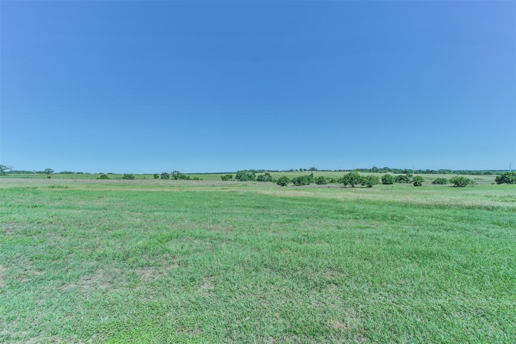 TBD Coshatte Road Bellville, Texas Come see a slice of country living on 11 AG EXEMPT acres located close to town on Coshatte Road. Previously 200 acres of family land that has since been divided, this tract is ready for you to come build your dream home or create new memories. This property is accessed by an easement and has LIGHT RESTRICTIONS. Restricted to NO MOBILE HOME PARKS but, 1 mobile home or single family dwelling is allowed on the property. The property also features a pond. Call listing agent Carli Conway to schedule your accompanied showing today! Neighbors have been mowing and bailing hay to maintain Ag exemption.