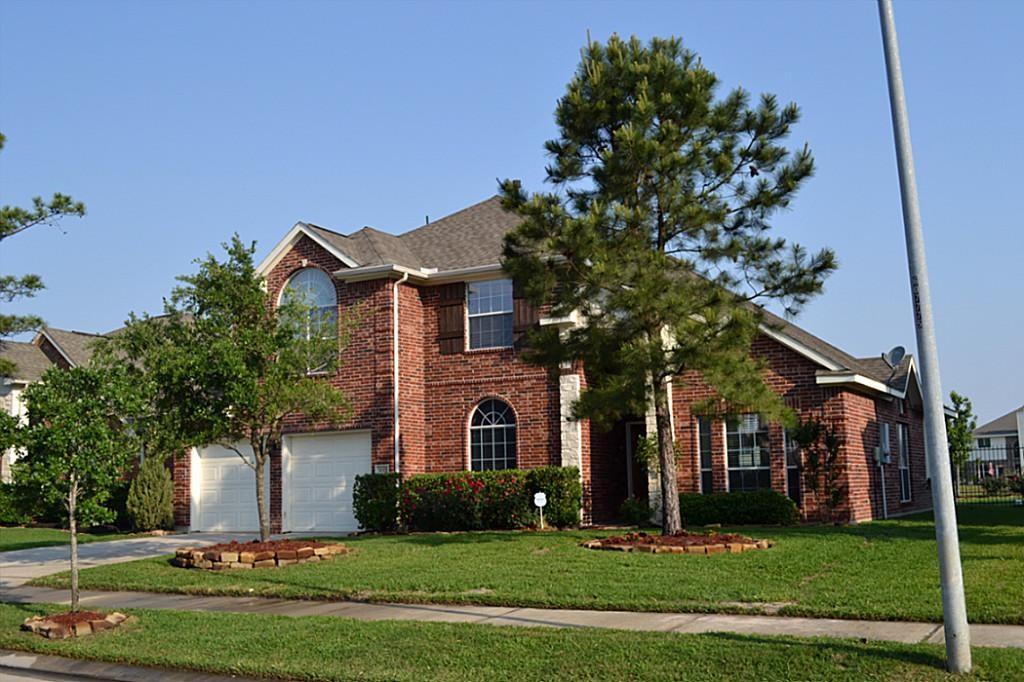 3015 Felton Springs Sring, Texas Style and charm are displayed with high ceilings, arches, and a flowing layout. Finishes include hardwood flooring throughout the 1st floor, stainless steel appliances, granite countertops, spacious primary bedroom with a large bay window on the first floor with a lovely lake view. There is a sprinkler system front and back, a gorgeous stamped concrete patio deck in the back with a pergola, and recently repaced wrought iron fencing with a gate to the walking path around the lake. This is much more than a house, it's truly a family lifestyle.