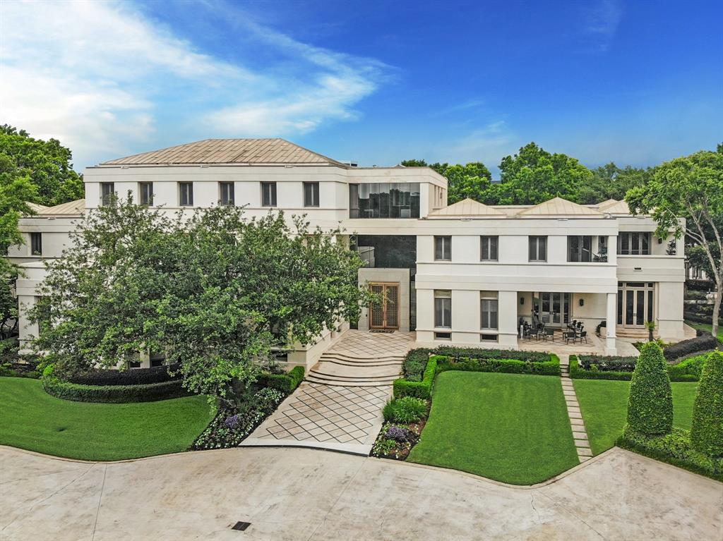 A River Oaks Modern Masterpiece. This highly regarded contemporary compound situated on over three acres of fully-gated grounds offers an opulent oasis of palatial proportions in a sublime setting just moments from Downtown. Regal reception spaces combine spectacular scale with substantial surfaces and serene views provided by the lushly landscaped grounds and natural bayou border. Incredible Owner's Retreat with central sitting room, fitness center, two terraces, and separate baths with designated dressing rooms. Resort-style amenities consist of a serene swimming pool terrace with cabana house and adjacent gazebo with commercial-quality teppanyaki grill. Sizable motor court with ample parking leads to a four-car garage and separate two-story staff accommodations.