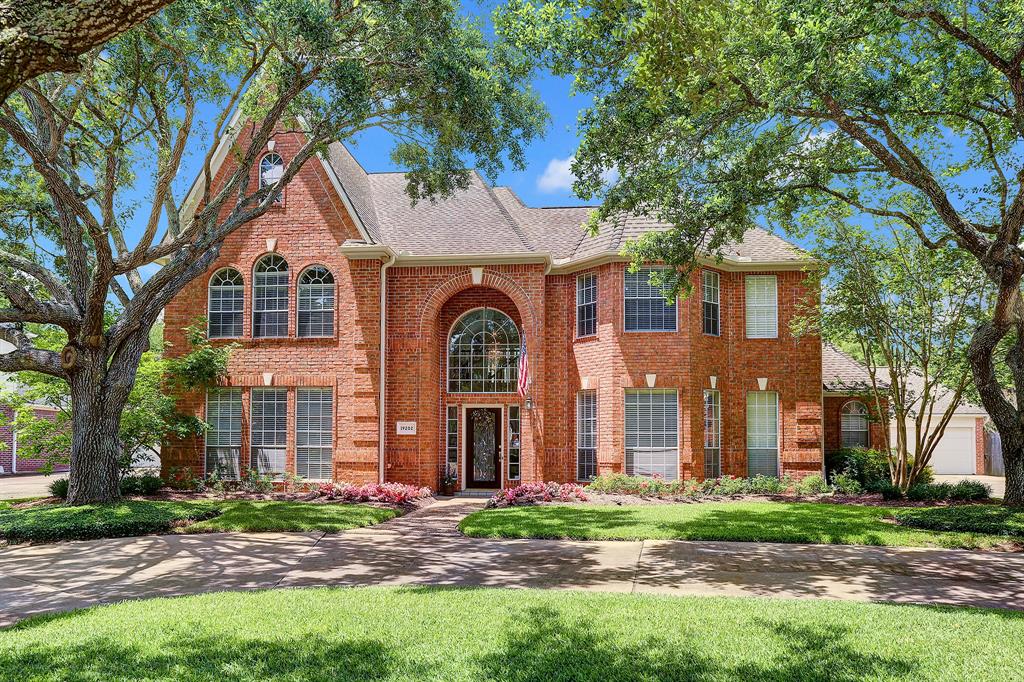 19202 Foxtree Lane Houston, Texas Gorgeous and classic this Windsor Park Estates home has everything you are looking for and is located on an incredible lot offering such a wonderful retreat with great landscaping, a beautiful pool and enormous covered patio perfect for relaxing and entertaining. Formal living room and dining room have abundant windows offering so much natural light. The study/ library off of the gracious two story entry is perfect for a home office. The island kitchen has serving bar, granite countertops and custom backsplash and is open to the breakfast room and family room which has a coffered ceiling and fireplace. The spacious primary bedroom is downstairs, overlooks the backyard and has a luxurious remodeled bath with an oversized shower and custom cabinetry. Upstairs are three bedrooms, 2 baths and a gameroom/exercise room. Tasteful updates and meticulous care make this home move in ready. 3 car garage, circular driveway. Katy schools!