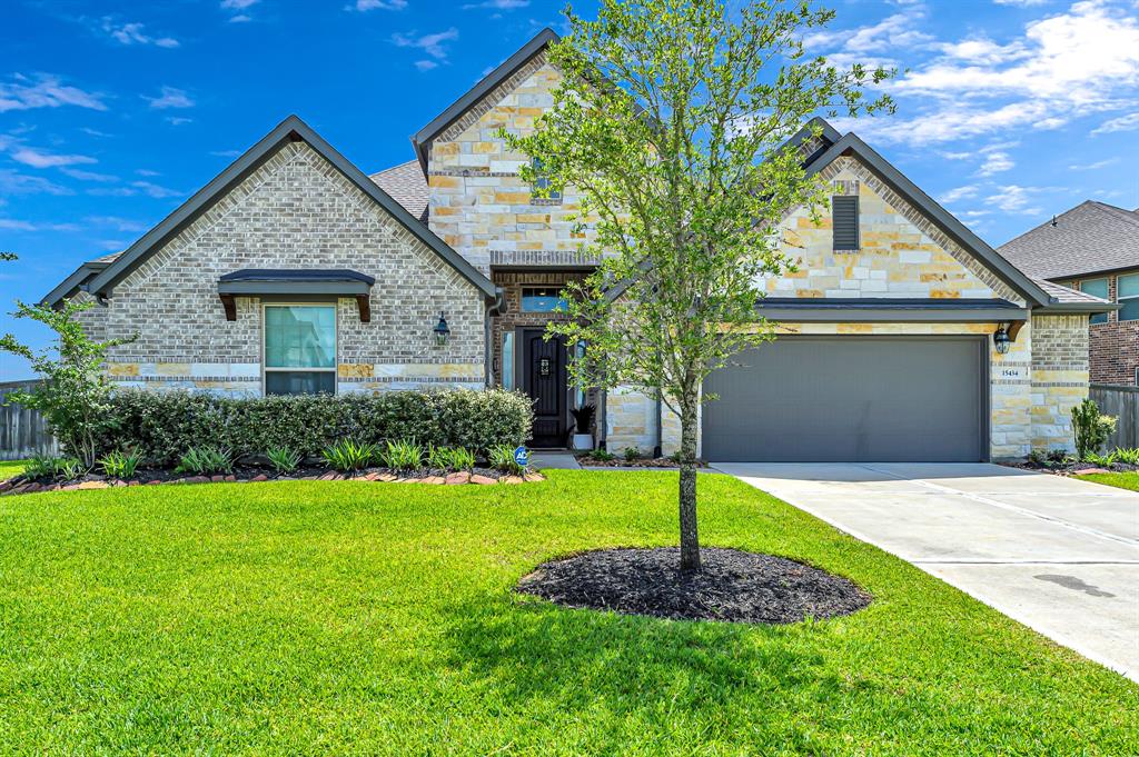 15434 Wildpoint Drive Cypress, Texas This home has it all! With a large covered patio overlooking the lake, a custom outdoor kitchen, a wooden pergola & a huge premium lot, you are going to love this property! And that is just the backyard! Wait until you see what is inside! Over $60,000 in upgrades make this home a rare find in Wildwood! This one-story, 4 bedroom, 3 bath Wi-Fi certified home, energy star Lennar home is loaded with upgrades and water views from the dining, living and primary bedroom! Enjoy the technology of surround speakers throughout - even in the primary bathroom! Lights are connected to Alexa, blinds are automated w/ remotes, plus many more bells and whistles! The floor plan is the Cobalt with the extended media room. Electrolux stainless appliances, a pot-filler over your gas cooktop, double ovens, upgraded cabinets & kitchen hardware, a huge island with exotic granite, gorgeous hardwood floors, designer tile inside & out, a 5 foot extension on the garage, tankless water heater and more! No Flooding!
