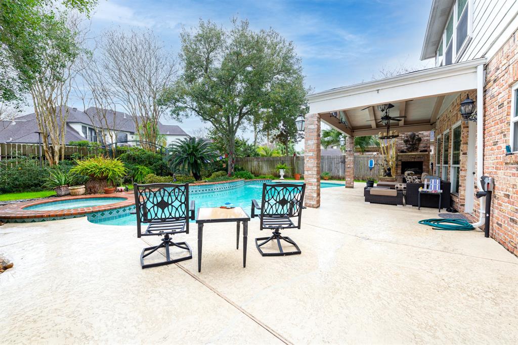 5663 Grand Floral Boulevard Houston, Texas Charming & unique Kickerillo built home in Twin Lakes with pool/spa. Never Flooded! Located in NW portion of neighborhood away from any road noise. Double pane windows added and roof replaced 2015. No carpet downstairs - all travertine, wood or tile. Crown molding & plantation shutters most rooms. Wood floored family room open to kitchen/breakfast rooms. Wood flooring in dining & living rooms. Spacious primary bedroom down w wood flooring & updated bath including granite counters. Large covered patio w gas log fireplace overlooking the pool/spa & landscaping. Kitchen features granite counters, double ovens, gas cooktop, pot rack, hardwood flooring, frig stays. Upstairs features wood floored gameroom w builtins and speaker system, 3 spacious bedrooms and 2 full baths. Water heaters replaced 2014 (tankless) & 2018 (40 gal). Washer/dryer stay. Enjoy the conveniently located neighborhood w pool, tennis, lakes, bus pickup for British, Awty, and Village schools & low tax rate.