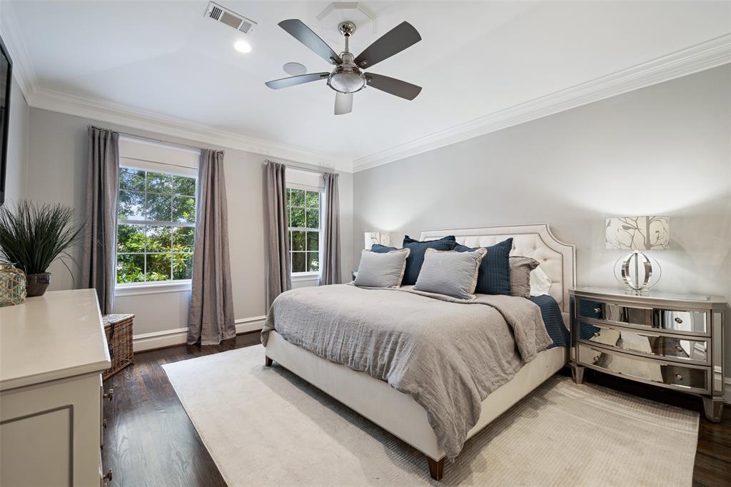 Welcome to your bedroom retreat. This large primary bedroom includes inlaid hardwood floors, a raised ceiling, and Sonos enabled built-in speakers.