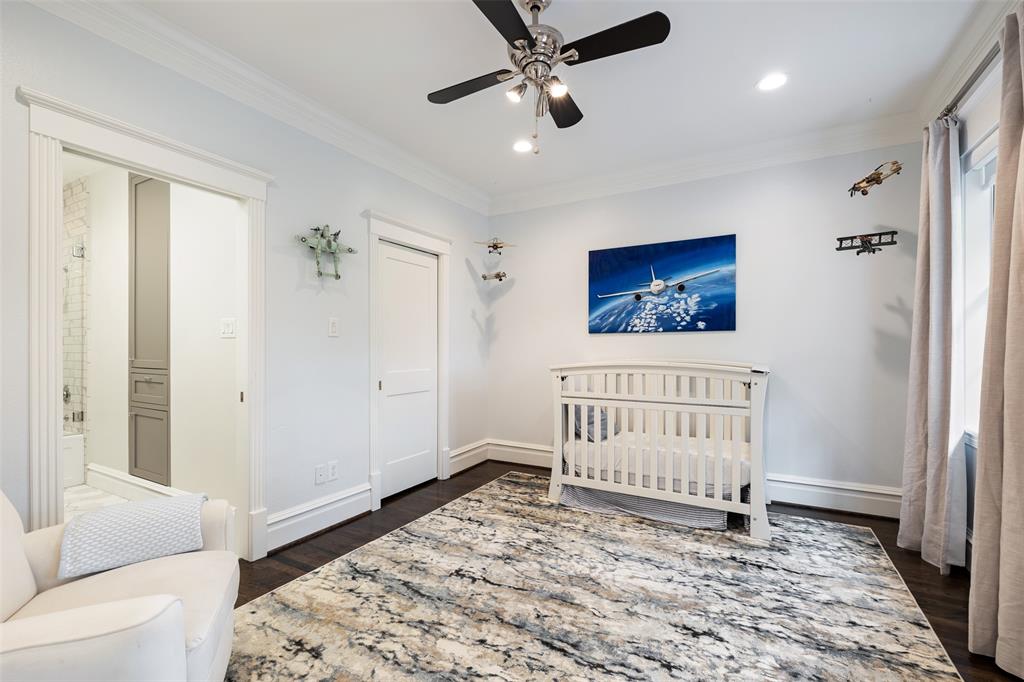 Like the rest of the secondary bedrooms, this generous space includes recessed LED lighting, a ceiling fan, hardwood floors, 2 panel doors, and a bathroom en suite. The walk-in closet includes custom built-ins.