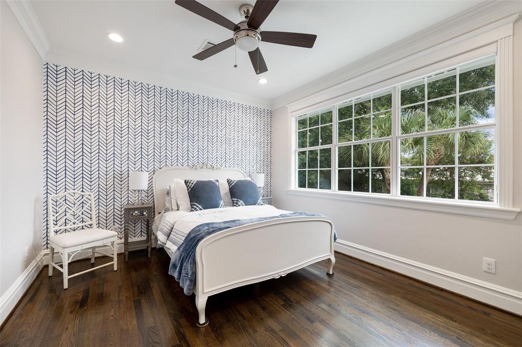 All of the bedrooms have great natural light. This one also has a gorgeous wallpaper accent wall.