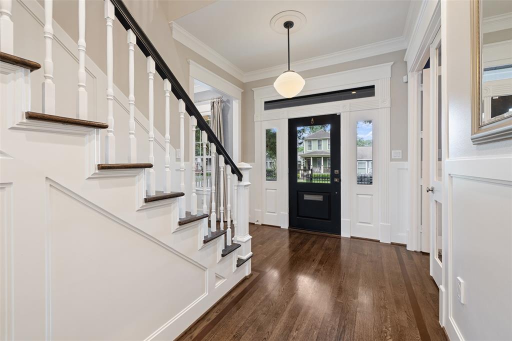 Once inside, you'll immediately be taken by the craftsmanship and detail throughout the home. Touches like Inlaid hardwood floors, wainscoting, and double crown molding add a feel of elegance to the home.