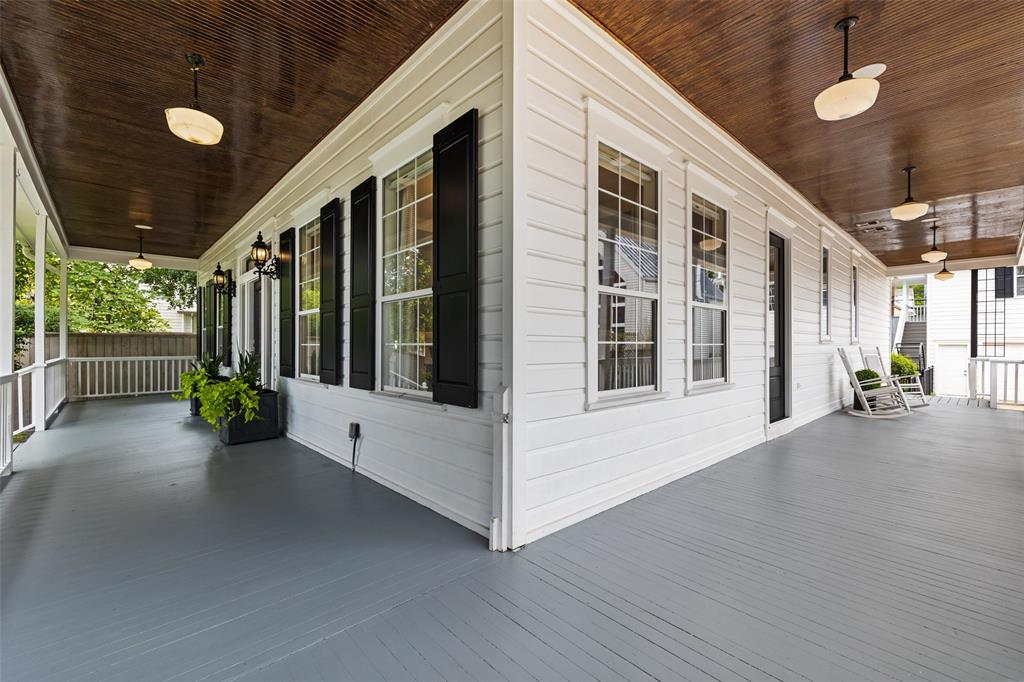 The wraparound porch is amazing. This space makes for a wonderful place to relax in the afternoon or entertain on the weekends. You'll love the stained wood beadboard, the classic light fixtures and built-in Sonos enabled speakers.