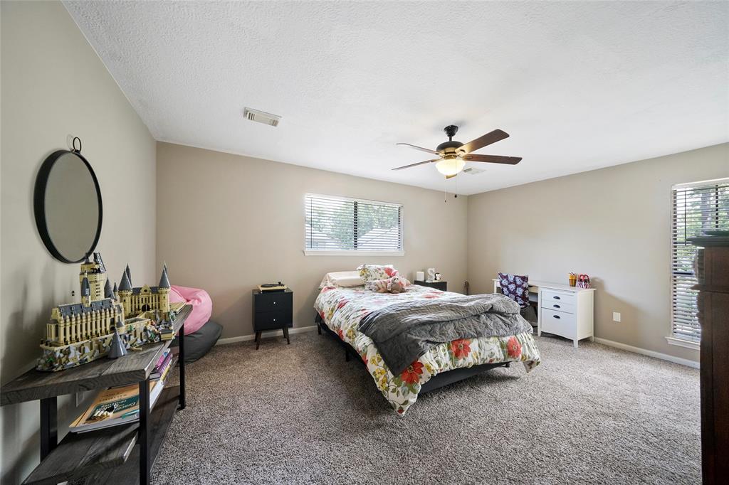 This oversized secondary bedroom can support a king-sized bed and furniture, and features updated carpet (2019), updated paint (2021), walk-in closet and direct access to Jack and Jill bathroom.