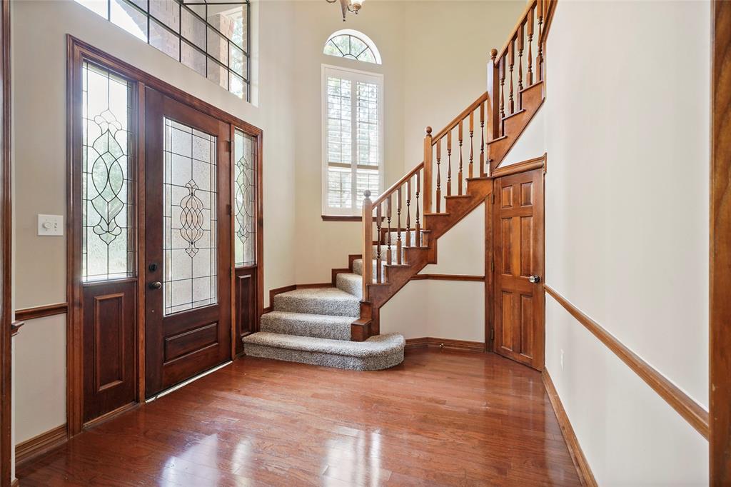 Warmth and light fill the entryway. The formal dining room dining room is to the right, while the entry way leads to the living room. The carpet on the stairs and all the second floor was updated in 2019 and the paint throughout the home was updated in 2020.