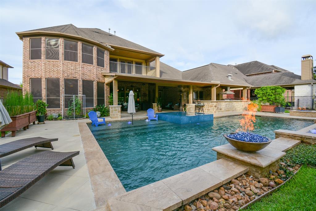 19211 Water Bridge Drive Cypress, Texas Welcome to this fantastic Trendmaker home with all of the upgrades & rooms a family could need! This home truly has it all! No backyard neighbors, 5 bedrooms & second to none backyard. Truly, this house is amazing! Pride in ownership is evident @ the curb with mature oak trees & beautiful landscaping. Upon entering you find warm wood floors, a spacious study & inviting formal dining room. Continuing into the family room you have a fireplace w/ stone as well as a kitchen thats open to the living! Your master suite is designed w/ a large bay window, spa-like bath & a huge walk in closet! Upstairs are secondary bedrooms, gameroom & media! Your backyard is where you will spend all of your summers lounging under the huge covered patio and grilling in your state of the art outdoor kitchen. Your pool is equipped with a spa, a tanning shelf, as well as fire and water features! Also, separate from the pool you have a gas fire pit! Located close to 99 and zoned to highly accredited schools!