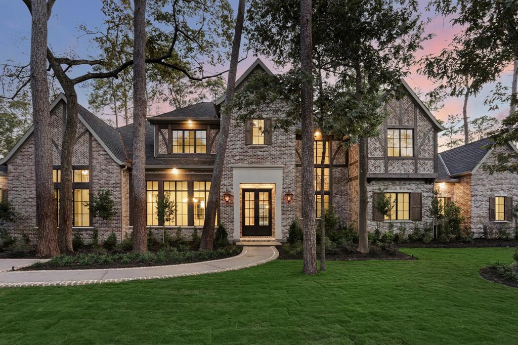 Another masterpiece from Metropolitan Custom Homes on a nearly one acre lot in prestigious Piney Point. This incredible Tudor inspired new construction has 5 bedrooms, 6 full baths and 2 half baths. Grand foyer and front staircase lead to formal dining, gallery, and study with built in bookshelves and a secret room. Open kitchen and great room with fireplace and full bar for entertaining. Walk in pantry and butler's pantry open to wine room. Downstairs utility room and catering kitchen. Downstairs game room and billiards room have a full bath and  open to veranda, summer kitchen overlooking phenomenal pool, spa and large yard. Second hallway gallery leads to spacious primary retreat featuring: sitting area, safe room, separate tub and glass shower, his and hers water closets and dressing areas. Upstairs are 3 guest suites, second game room with wet bar, golf simulator, second utility room, half bath. Driveway with gate and off street parking, four car garage.