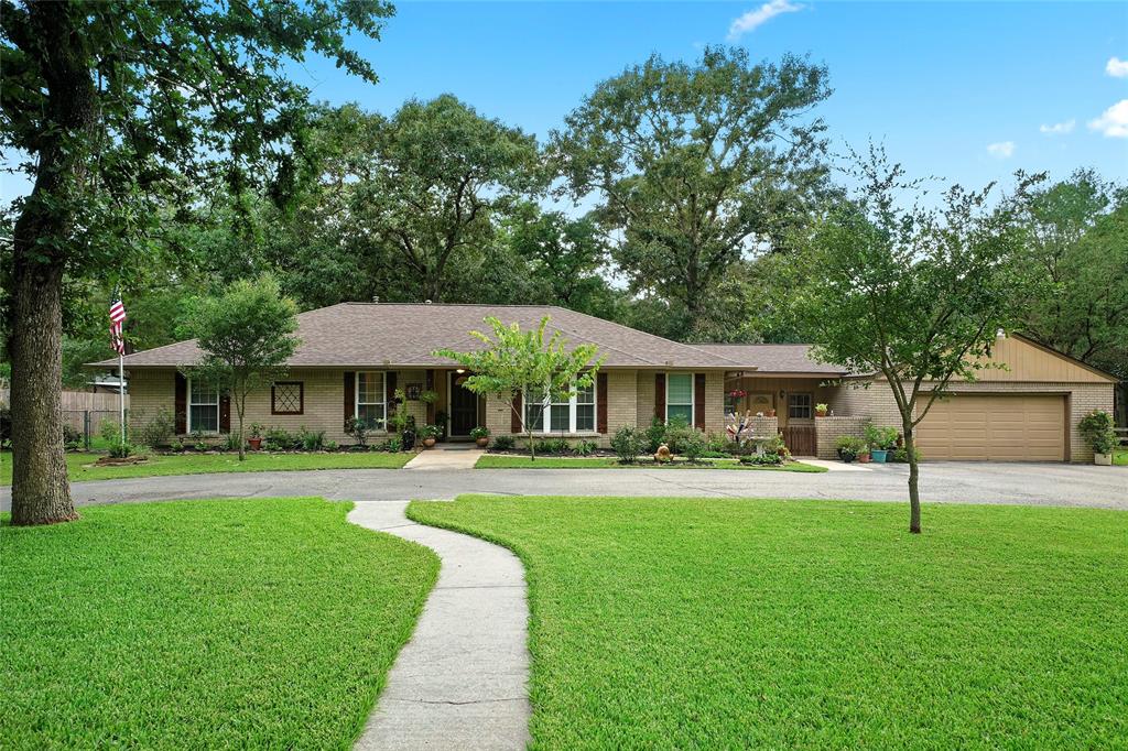 Gorgeously renovated Ranch-style home located on a 2.4 acre wooded lot.