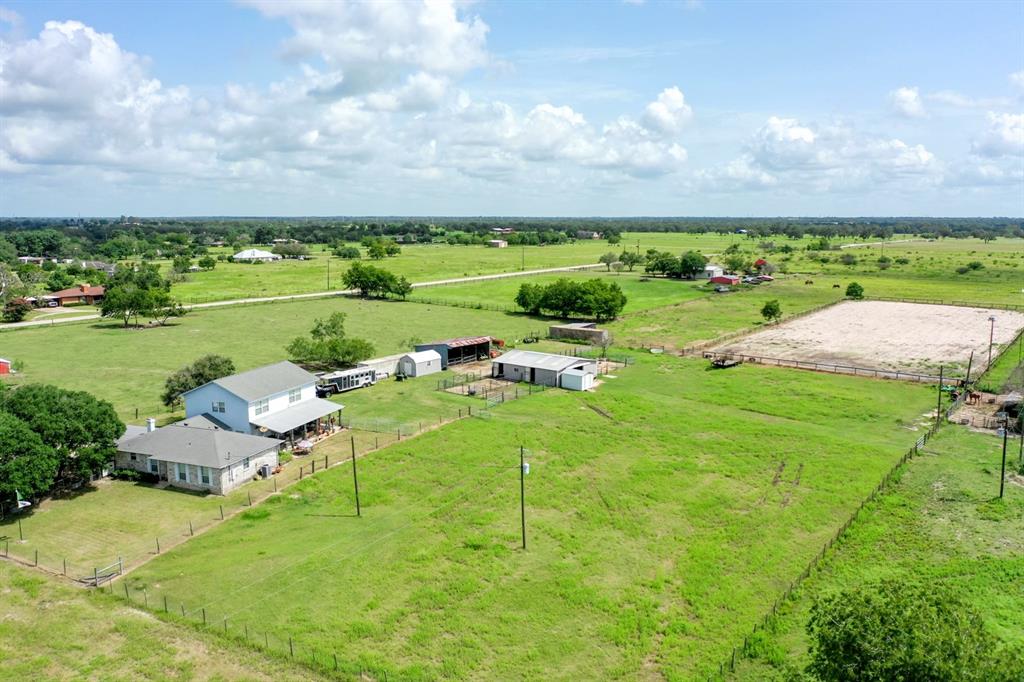 1590 Fm 2776 Bryan, Texas Excellent location of this beautiful county home on 8.4 acres located in Wickson Valley and set up nicely for hobby farmers, livestock show families, or rodeo and equine enthusiasts of all types. The home features 3733 sf, 3 beds, 3 baths, with a massive primary suite and office/game room, a private safe room, site built oak cabinets, Enercon vinyl replacement windows, and an oversized cedar framed outdoor covered porch to wind down. The entry drive is lined with live oak trees, planted with acorns from Texas A&M campus. The land is fenced and cross fenced with a front, middle, and back pastures/traps and features a 5 stall horse barn with cement center aisle, wash stall and feed room. Also on the property is an impressive 150 x 300ft riding arena and a 24x36ft 3 sided hay/equipment barn. Shipping container and appliances are included with the property!